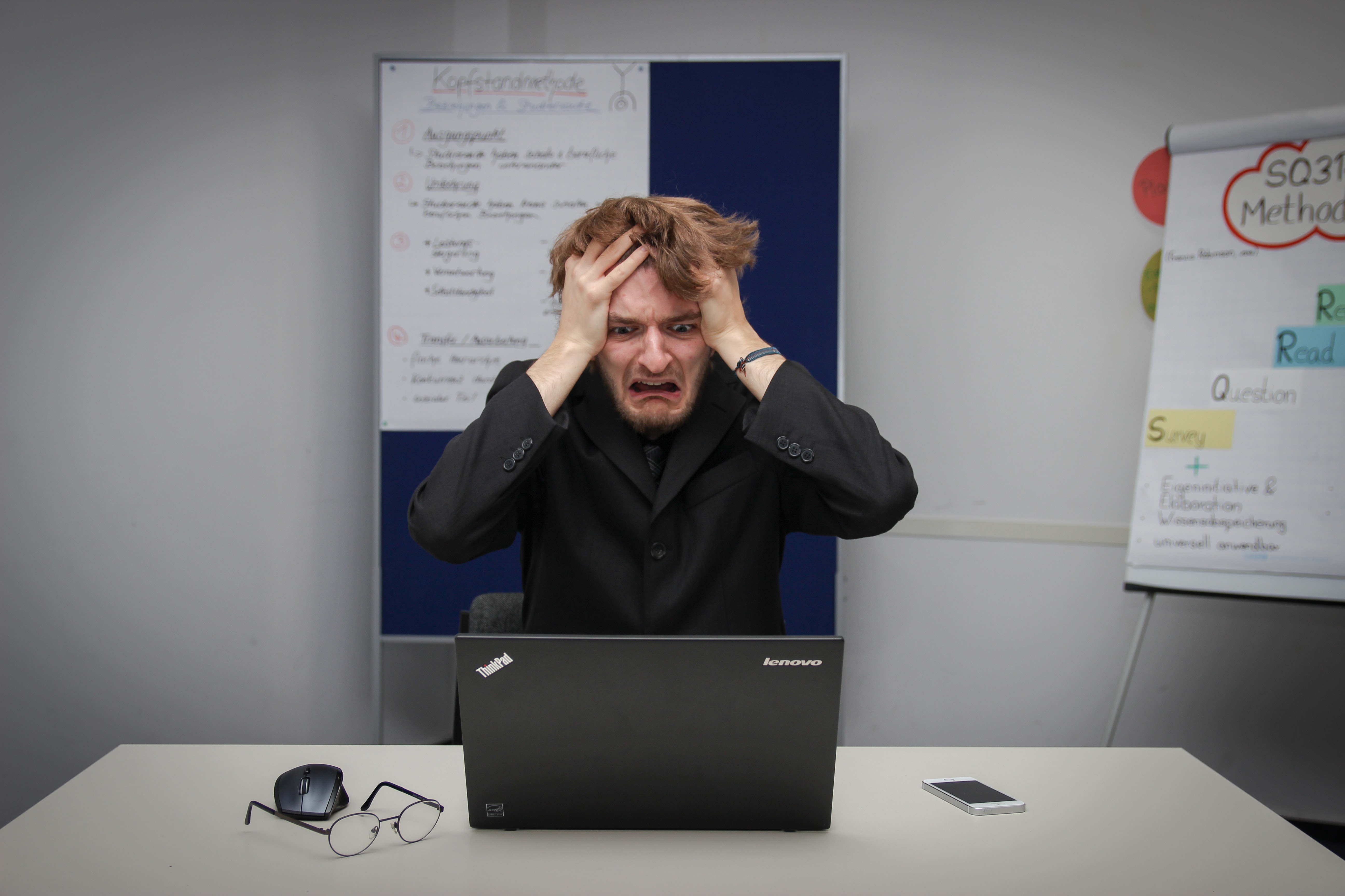 This image shows someone who is worried because their computer is infected with a virus or malware.