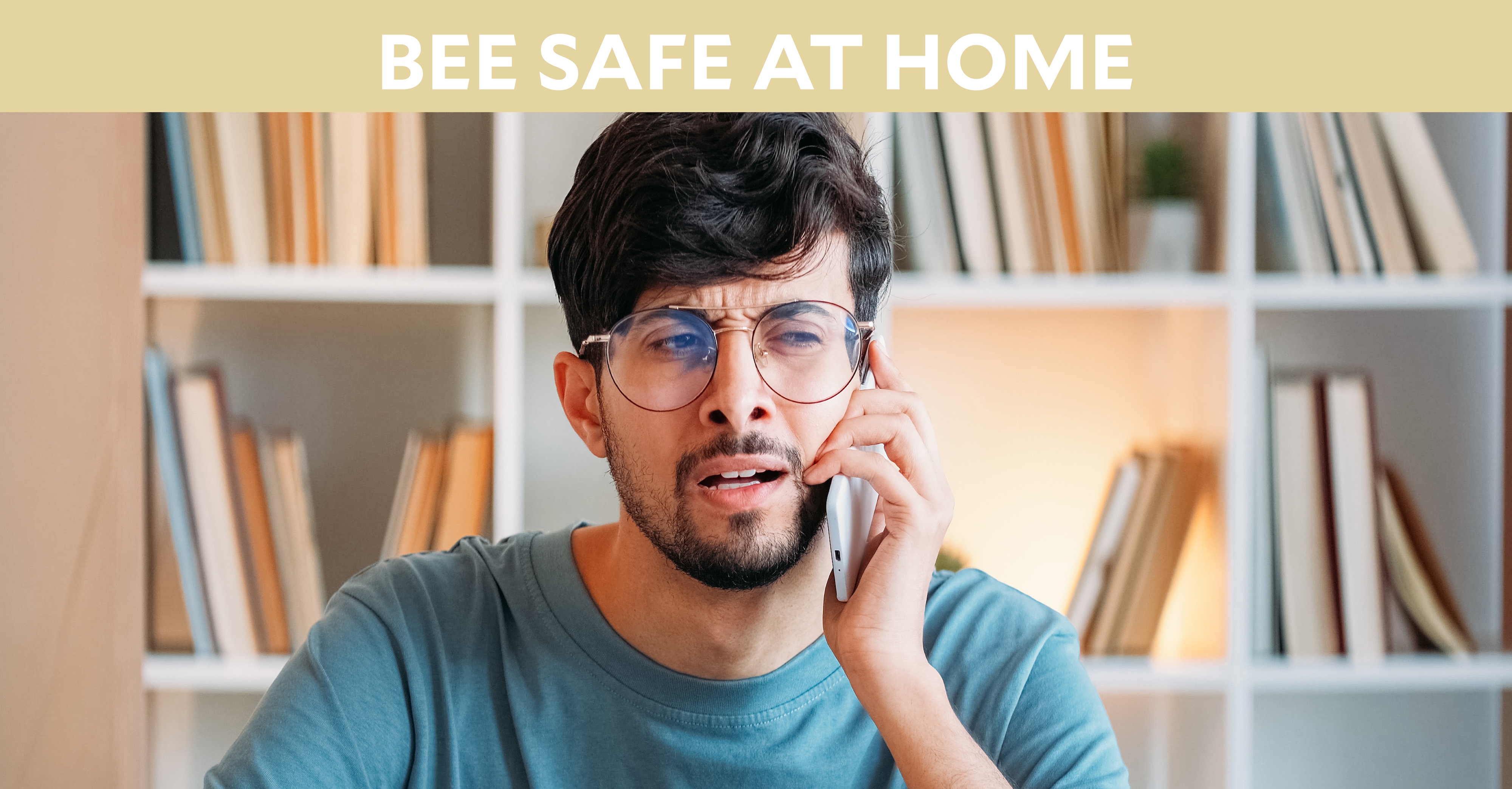 Bee Safe at Home: Man speaking on smartphone looking shocked