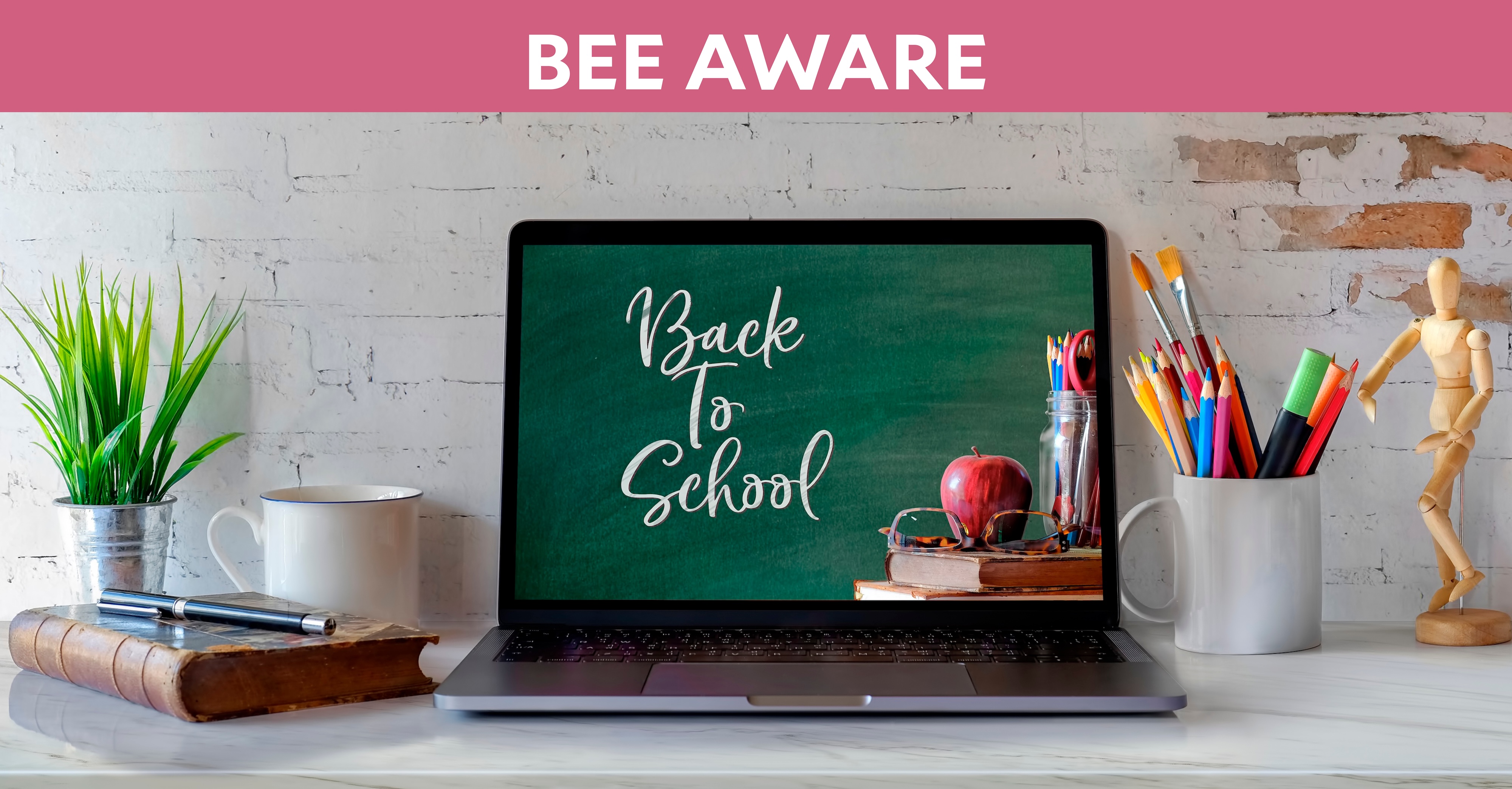 Bee Aware: A laptop with onscreen text "Back to School"