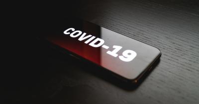 covid-19 written on mobile device
