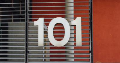 Picture of the number 101 at the entrance to an office