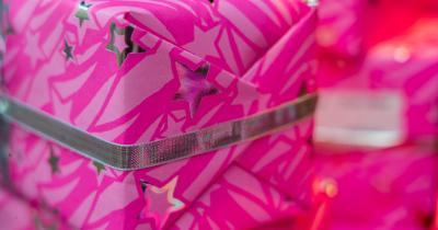 Picture of present wrapped in pink paper with ribbon