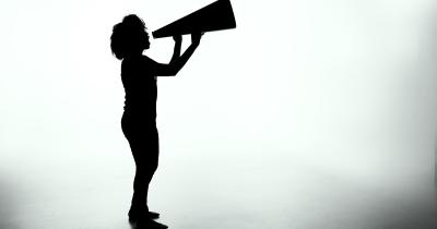 Woman speaking into megaphone