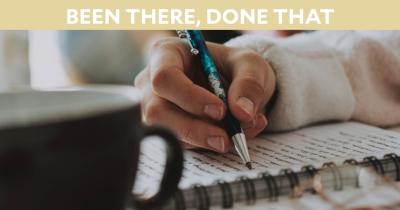 Woman writing in journal