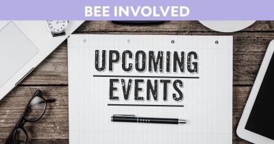 Laptop and tablet on desk next to loose-leaf paper with the text "Upcoming Events"