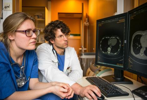 Doctors are at computer looking at patient data. This data is subject to HIPAA