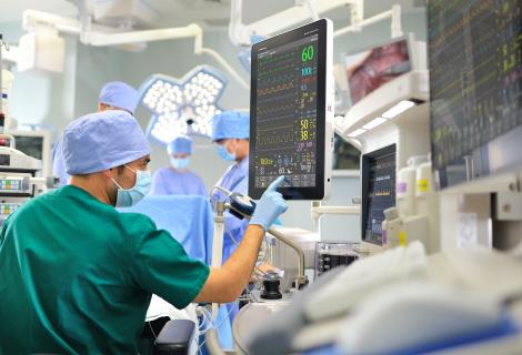 This shows a doctor using an IT System at the hospital. This system is classified as High Risk, HIPAA