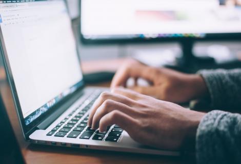 Person typing on a laptop