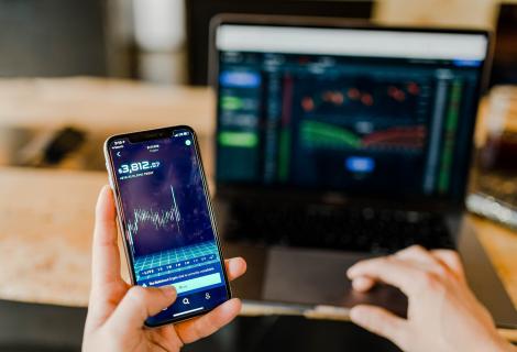 This image shows data displayed on a computer and mobile device. The computer and mobile device need to be secured to protect that data, based on its classification.