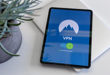 Picture of a tablet on a desk. The tablet screens says VPN