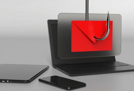 Laptop with envelope and fishing hook